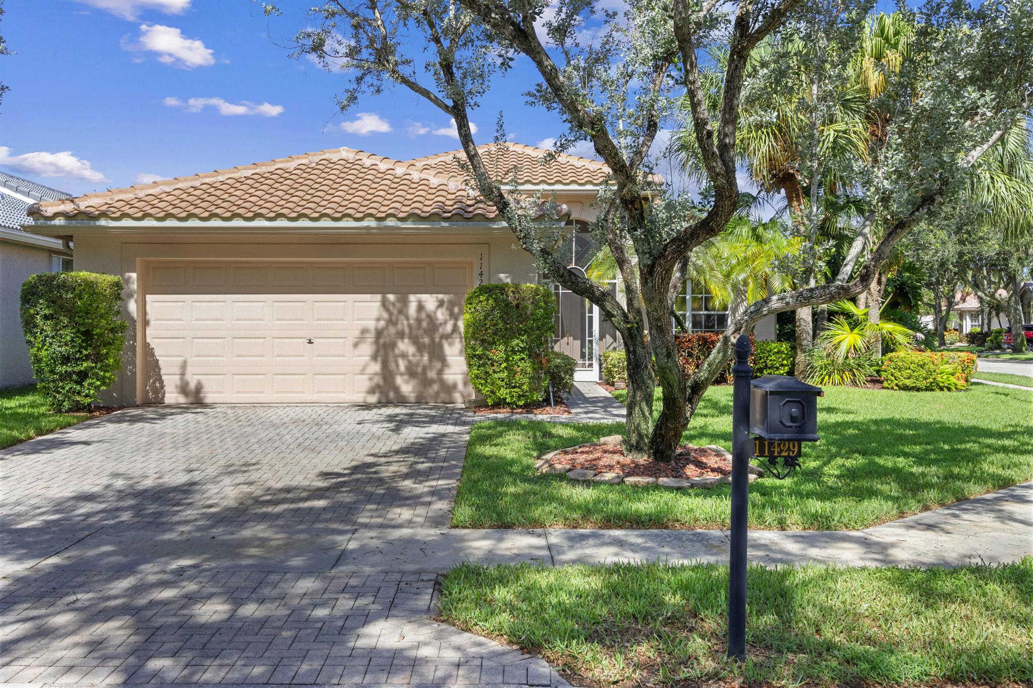 NEW ROOF! 2023! This well loved immaculate Atlantic Model is known & loved for its open concept. PRICED TO SELL, this two bedroom/two bath plus a den/office/3rd bedroom is the perfect home for entertaining or simply enjoying South Florida. Kitchen features granite countertop & backsplash, pantry & newer refrig. The 2nd Bedroom w/ deep walk-in closet. Ceramic Tile throughout the main living area with laminate in the primary and office. 2023 A/C! Hot water heater has been replaced & new garage motor installed. Plush landscaping creates a private oasis & has partial water view. Screened lanai. 2 Car Garage. Valencia Isles renovated clubhouse features a Bistro and amenities to keep you busy all week long. Four additional pickleball courts and 2 bocce courts coming soon!