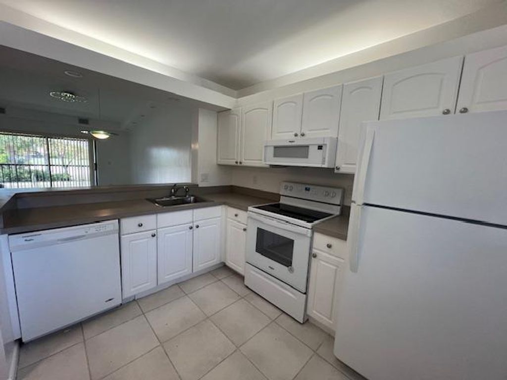 Photo of 6585 Somerset Drive #201, Boca Raton, FL 33433 (MLS # R10991711)