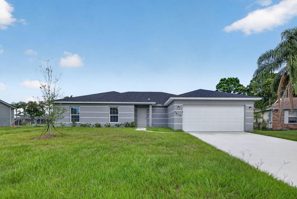 Photo of 1517 SW Aledo Lane, Port Saint Lucie, FL 34953 (MLS # R11110543)