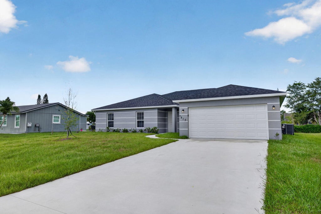 Photo of 1517 SW Aledo Lane, Port Saint Lucie, FL 34953 (MLS # R11110543)