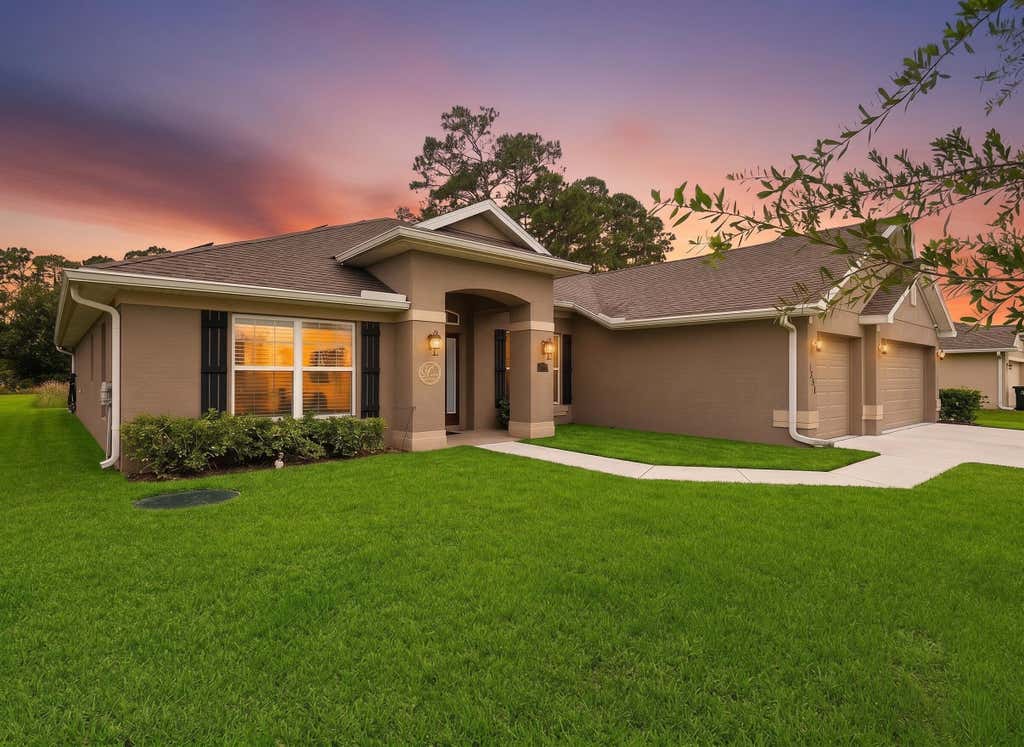 Photo of 1858 SW Mackenzie Street, Port Saint Lucie, FL 34953 (MLS # B26032312)