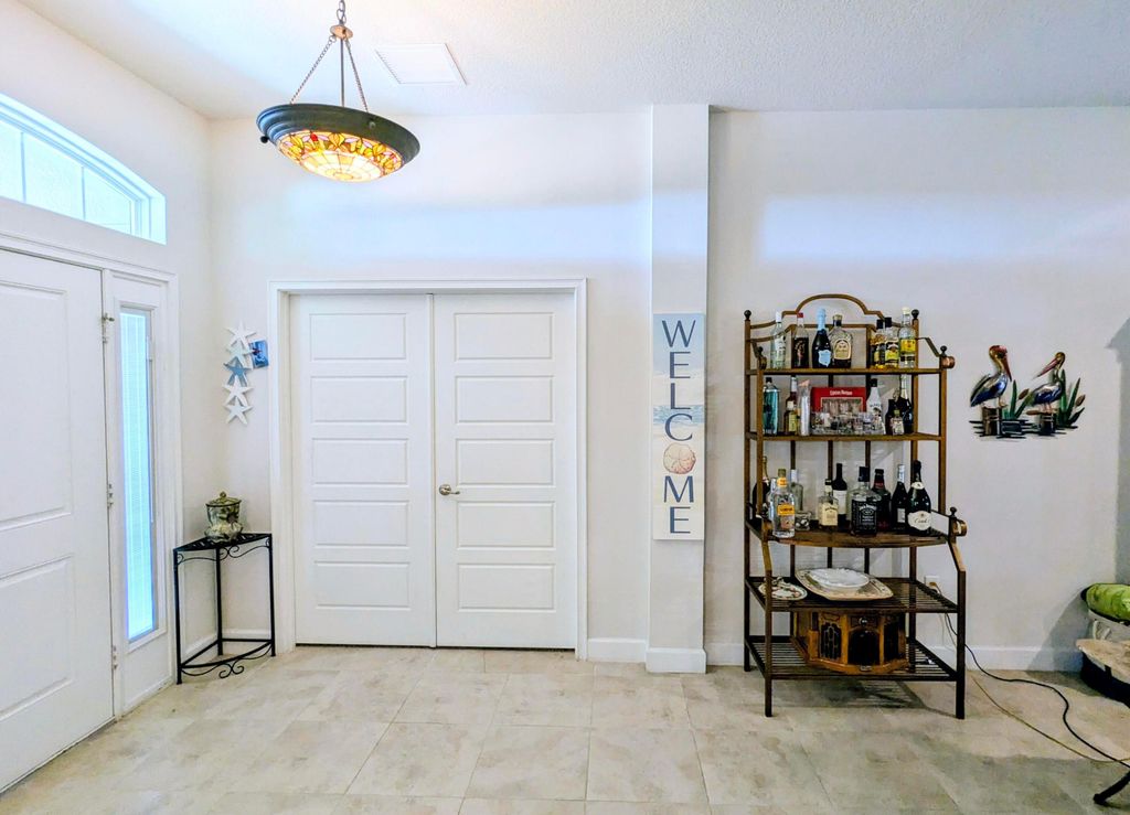 Photo of 1858 SW Mackenzie Street, Port Saint Lucie, FL 34953 (MLS # B26032312)