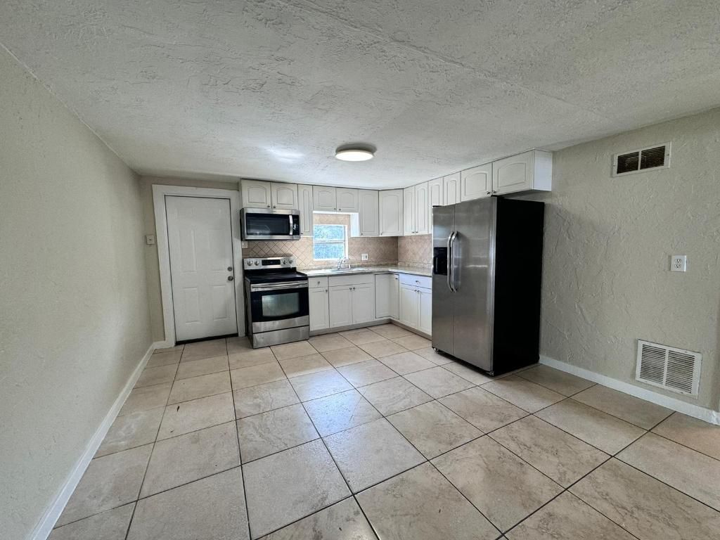 Photo of 1132 Tangelo Avenue, West Palm Beach, FL 33406 (MLS # R10968842)