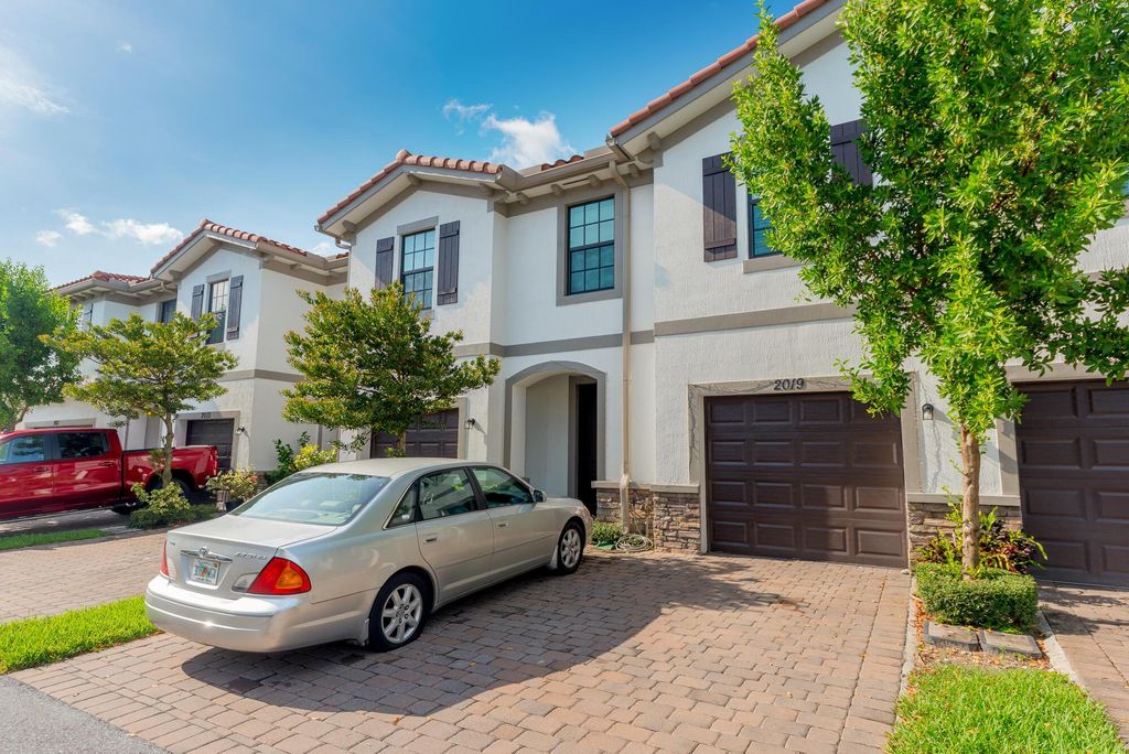 Photo of 2019 Sugar Maple Drive, Riviera Beach, FL 33410 (MLS # R10905629)