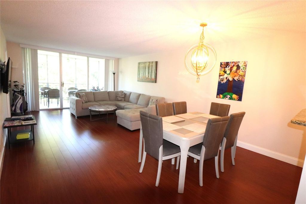 Photo of 3850 Oaks Clubhouse Drive #506, Pompano Beach, FL 33069 (MLS # F10410017)