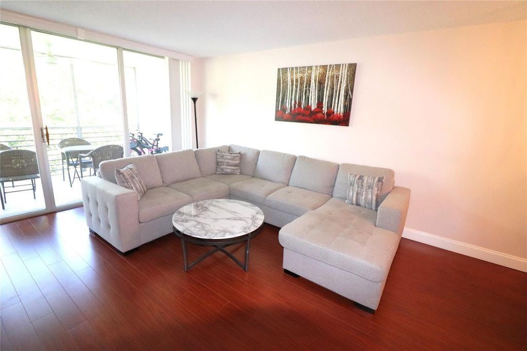 Photo of 3850 Oaks Clubhouse Drive #506, Pompano Beach, FL 33069 (MLS # F10410017)