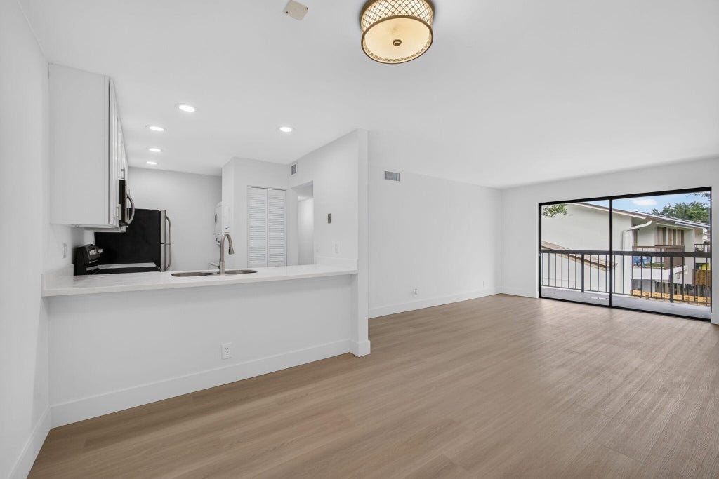 Photo of 3404 Gardens E Drive #21B, Palm Beach Gardens, FL 33410 (MLS # B26070403)
