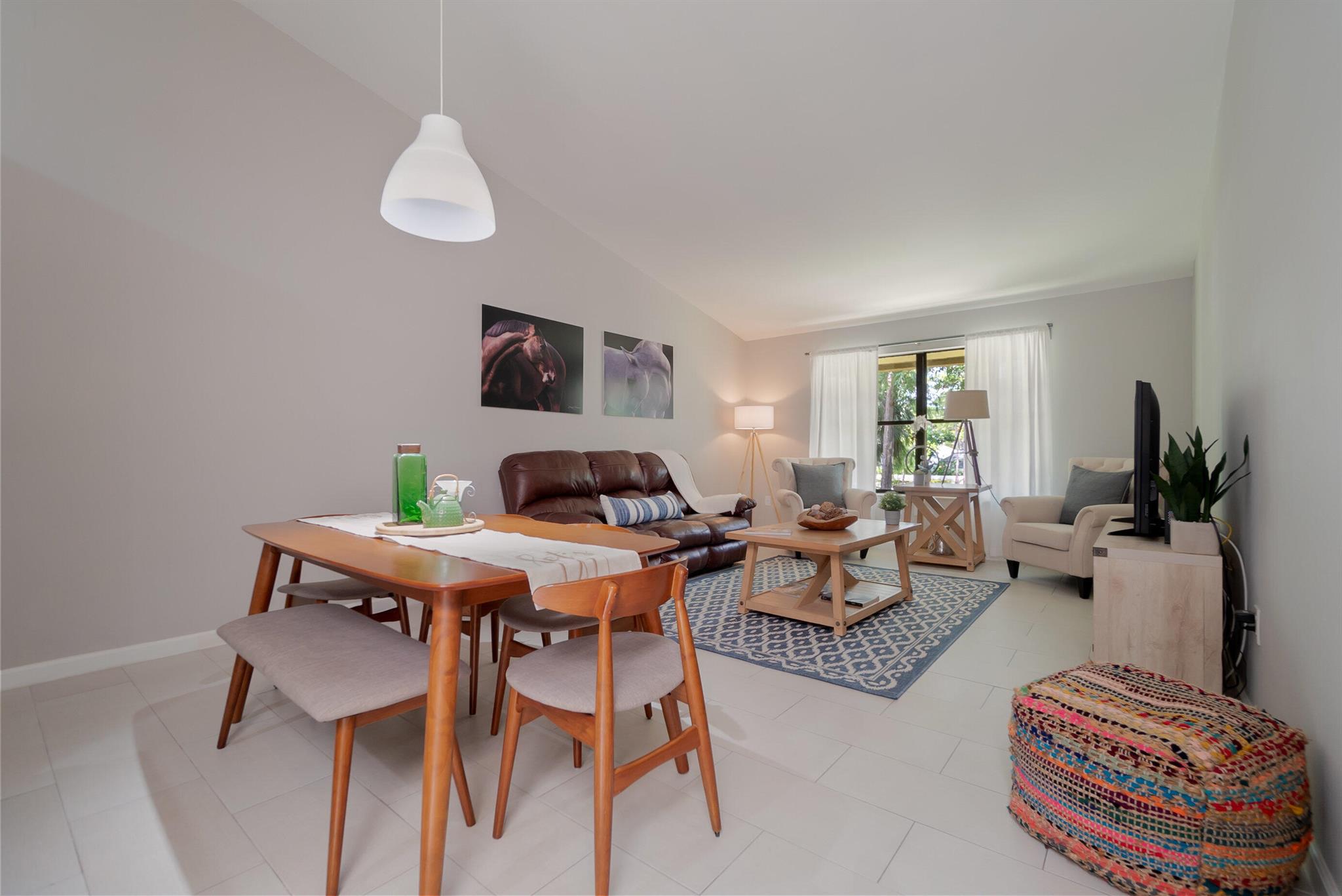 This immaculate, tastefully designed one story condo with a screened balcony invites comfort, and exudes modern elegance. With 3 bedrooms, 2 baths, generous living space and stylish finishes, you'll enjoy a perfect setting for relaxing and entertaining. The unit was remodeled and redecorated to please the most sophisticated resident! Zoned for great schools and located close to WEF, Dressage, Polo facilities, fine restaurants, and the beaches, .The condo features a king bed in the master bedroom, a queen bed in the second bedroom, and two twins in the third bedroom. An open concept kitchen, two bathrooms, and a spacious living space.