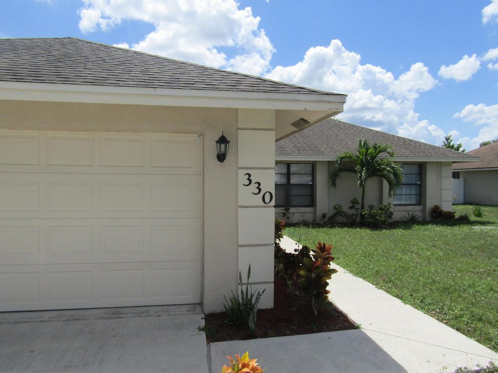 Photo of 330 SE Inwood Avenue, Port St Lucie, FL 34984 (MLS # R10909898)