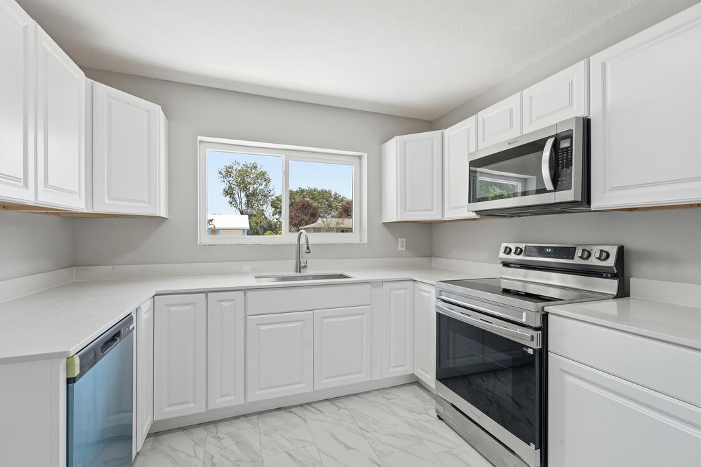 Photo of 1343 SE Vestridge Lane, Port Saint Lucie, FL 34952 (MLS # B26019029)