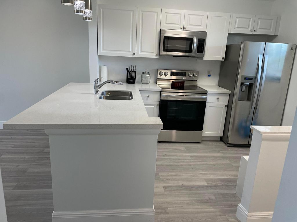 Photo of 7101 Golf Colony Court #203, Lake Worth, FL 33467 (MLS # B26013547)
