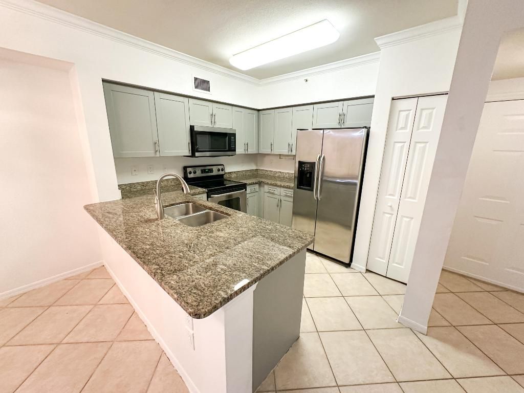 Photo of 6434 Emerald Dunes Drive #203, West Palm Beach, FL 33411 (MLS # R11149628)