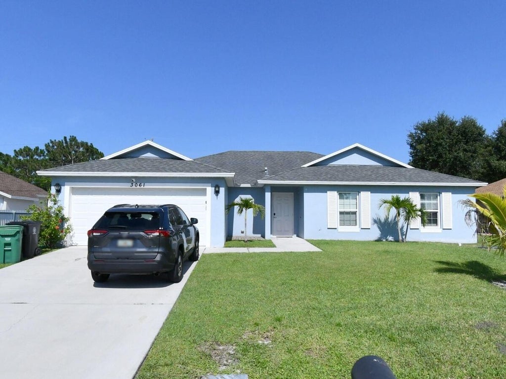 Photo of 3061 SW BRIGGS Street, Port Saint Lucie, FL 34953 (MLS # B26062953)