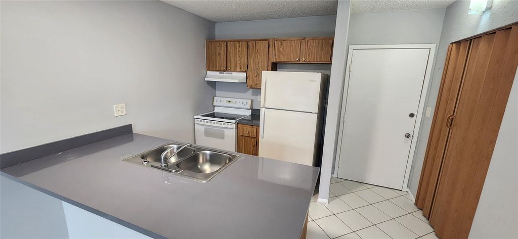 Photo of 2501 Riverside Drive #513-A, Coral Springs, FL 33065 (MLS # F10459077)