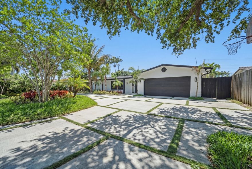 Stunning fully remodeled 4-bedroom, 2.5-bath home in desirable Coral Ridge Isles. Features include a brand-new roof, full impact windows and doors, and modern finishes throughout. Beautiful updated kitchen and bathrooms, plus gorgeous flooring and an open, inviting layout. Enjoy a private backyard with a sparkling pool, perfect for relaxing or entertaining, along with a circular driveway and two car garage. Move-in ready and impeccably updated. this home has it all.