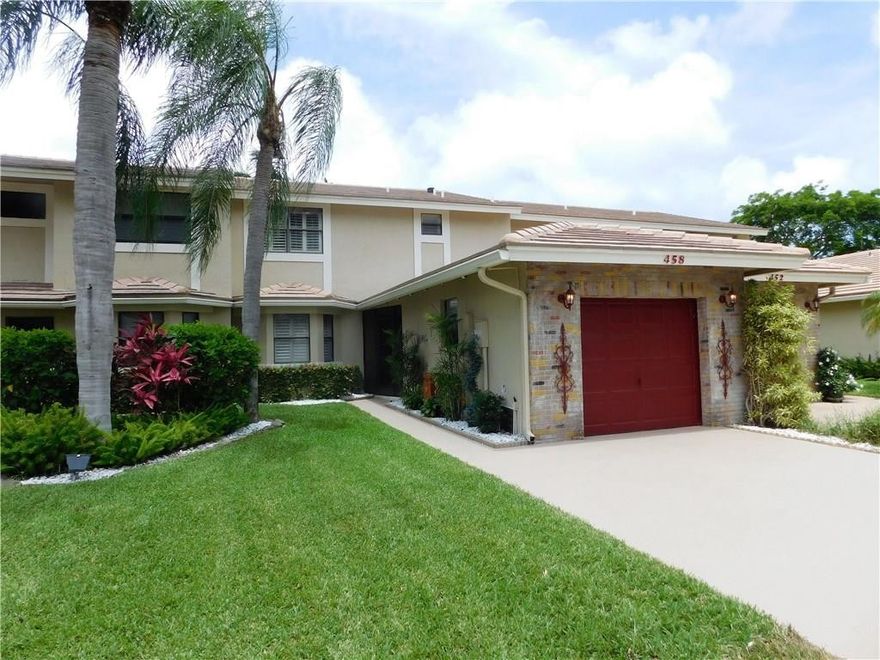 Beautifully updated with a lake view! Large eat-in kitchen completely remodeled with granite counters and custom cabinets! Two master "en suites" upstairs with huge walk-in closets. Spacious dining/living room area overlooks a paved patio with small POOL & gorgeous lake view. French doors & Plantation shutters throughout. Deer Creek is an ideally located golf community in Deerfield Beach, FL with spectacular golf & lake views! It’s a country club atmosphere without the country club expenses!