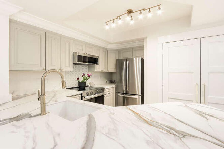 Experience downtown living in the most elegant condominium in West Palm Beach! This exquisitely remodeled, pool-view unit speaks to the style and sensibility of the entire City Place area--your new backyard. Walk the bridge from your building directly into the heart of beautiful City Place. Take a stroll through the shops, choose from a fine selection of restaurants and cafes, and take in performances and community events on the lawn. Inside the freshly renovated unit (completed Feb '26), find stunning Carrera marble floors and showers, marble top vanities, porcelain countertops, all new custom doors and trim, walk in closets, and recessed lighting throughout. Every finish, from appliances to floors, is brand new. Parking is on level 3 of garage, which means you walk right in. No elevator!