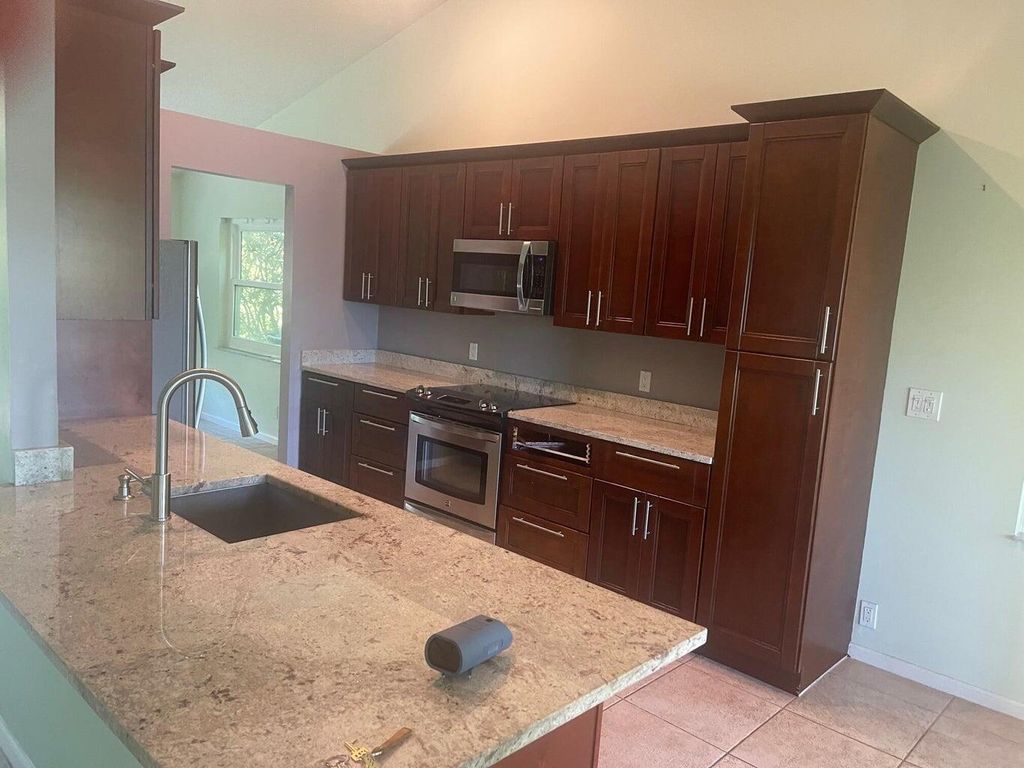 Photo of 3755 W Riverside Way, Delray Beach, FL 33445 (MLS # R11070101)