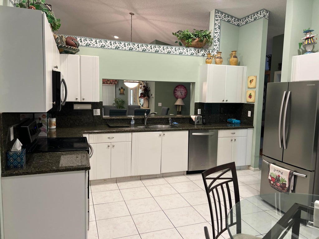 Photo of 9632 SILLS Drive E #204, Boynton Beach, FL 33437 (MLS # B26080004)