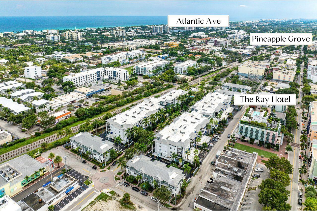 Welcome to Pineapple Grove Village, where downtown Delray Beach living meets modern comfort. This top-floor residence offers a peaceful retreat just steps from the city's vibrant core, with Atlantic Avenue's restaurants, galleries, and boutiques only two blocks away. Inside, the property is finished with sleek tile flooring throughout, and its thoughtfully designed split floorplan provides privacy between the bedrooms while keeping the main living area open and connected. Positioned in the heart of the Pineapple Grove Arts District, residents enjoy walkable access to the neighborhood's creative energy, including public art, music venues, and the eclectic shops and cafes that make this area one of Delray's most desirable addresses.