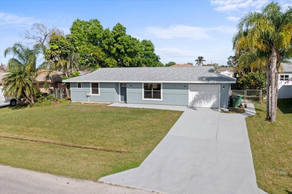 Photo of 667 SE Starfish Avenue, Port Saint Lucie, FL 34983 (MLS # R10951198)
