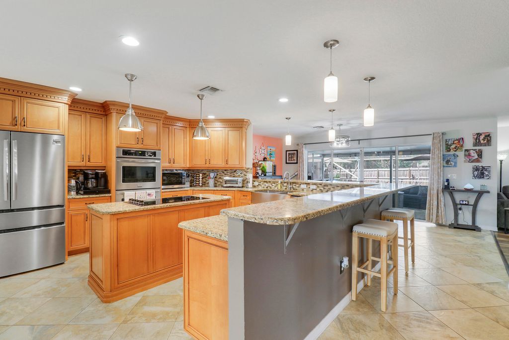 Photo of 1881 SW Taurus Lane, Port Saint Lucie, FL 34984 (MLS # B26030365)