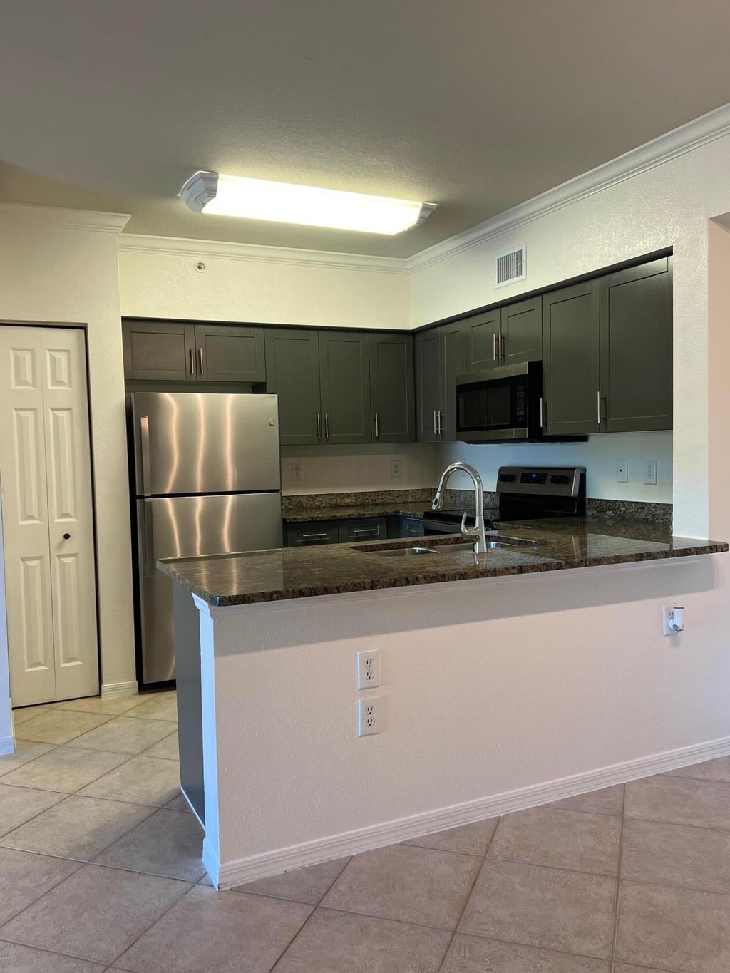 Photo of 6434 Emerald Dunes 302 Drive #302, West Palm Beach, FL 33411 (MLS # R11093412)