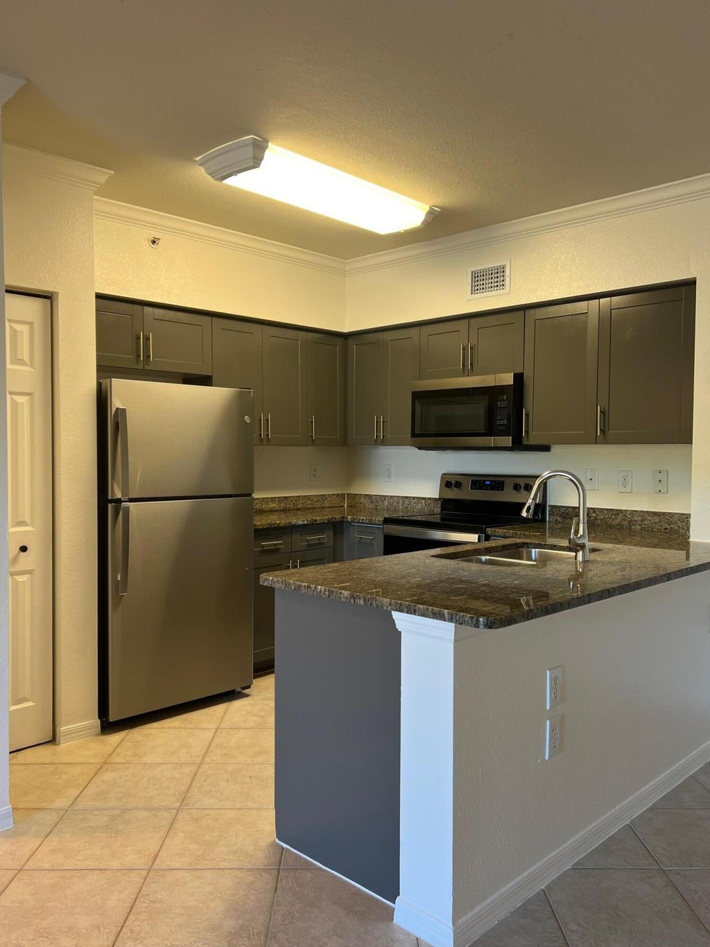 Photo of 6434 Emerald Dunes 302 Drive #302, West Palm Beach, FL 33411 (MLS # R11093412)