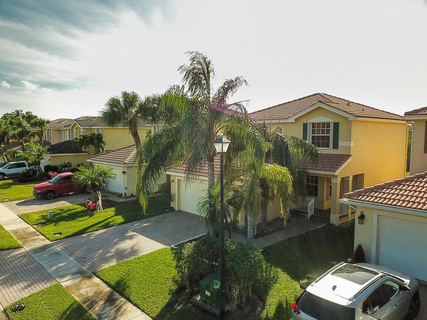 This absolutely pristine home needs only your family...nothing else!.  Your home has a great layout with serene water views from the kitchen, family room, master bedroom and a guest bedroom.  Very quiet on 
a dead-end street so no through traffic. 
Fantastic Ben Gamla charter elementary school is just 12 minutes away.  The 1 1/2 year old sprinkler system draws water from the lake which is a money saver for you.  The stove, dishwasher, microwave oven and the sink are new.  The A/C is 5 years old, water heater is 6 years old.  Accordion shutters throughout.  House has been professionally pressure-washed on the outside - from the roof down - and professionally painted outside (and inside). Located in a wonderful family community built with kids in mind, the amenities include a splash pad, a resort-type pool, multiple play ground areas (tot lots), beach volleyball, an exercise room and tennis courts. You will never be bored! After all the excitement, relax in your over sized lanai and gaze out over the tranquil water. Schools are very close by with the elementary school within a short walk and the beach is only a 14 minute drive