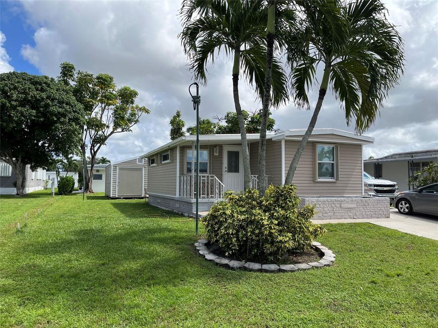 Experience the look and the feel of a brand new home, totally upgraded with quality inside and out. 2 bedrooms, 2 bathrooms, Shower in master bedroom & Tub in second bathroom. Split  bedroom plan. New 2025 Lenox 3 Ton Central A/C and new ductwork. New Sheet rock on all walls and ceilings. Energy efficient. Highest electric bill was less than $100.00.  Roof recently renovated. Living Rm floor is wood laminate. New tile through out the rest of house. 2 storage sheds includes 12x20 recent model. Accordion hurricane shutters on all windows. Rear bedroom has private separate entrance & bath. Washer and Dryer Inside house. House is wired with four exterior security cameras. Kitchen has  deep stainless steel sink, new solid wood cabinets, new countertops, has a food pantry and a separate closet.