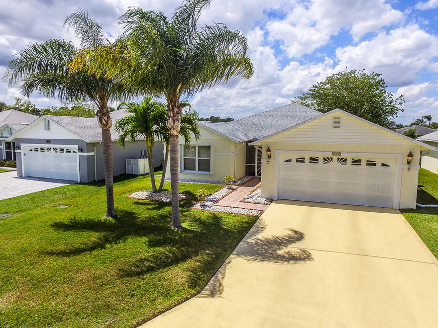 Welcome to retirement living at it's best! As one of the largest CBS homes available in Palm Grove this house does not disappoint. Low HOA fee includes your water, sewage, security gate, lawn care, basic cable and more. Prime lakefront location, and walking distance to pool. Beautiful clubhouse with heated pool, tennis, bocce and many social events held all year round. Large master plus two additional guest rooms, two full baths ceiling fans in all rooms, new carpet, new roof and fairly new appliances. Magnificently finished Florida room boasts floor to ceiling window, new tile floor and spectacular view. Full appliance package included and has complete accordion shutters.