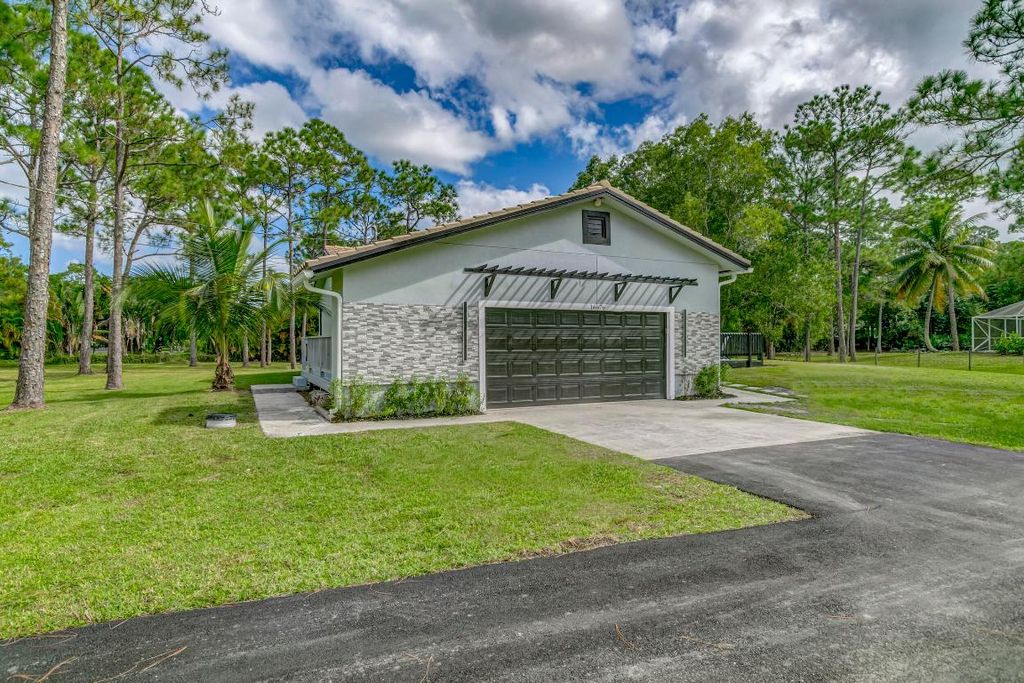 Photo of 16676 123rd Terrace N, Jupiter, FL 33478 (MLS # R10948408)