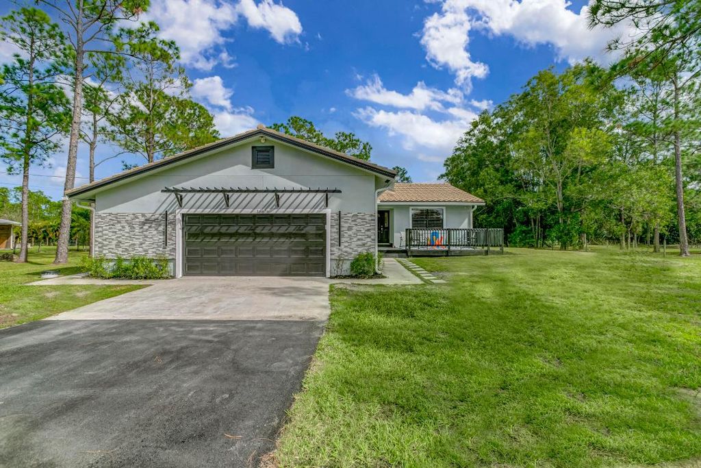 Photo of 16676 123rd Terrace N, Jupiter, FL 33478 (MLS # R10948408)