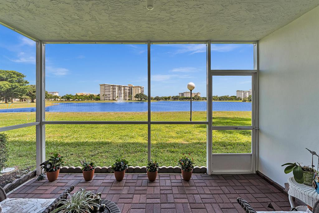 Enjoy the view from this ground floor 2 Bedroom, 2 Bath condo in Palm-Aire. This sunny unit has Tile Floor throughout, a Split Bedroom floor plan, a breezy Screened in Paver Patio, and Impact Windows in the generously sized Guest Bedroom. Two En-suite Baths offer privacy for all. The Lake View is so peaceful you may not want to leave! This is an All Ages building within Palm-Aire, conveniently located near Shops, Restaurants, and Isle Pompano Park Casino. Amenities include multiple Swimming Pools, Basketball, Fitness Center, Shuffleboard, Tennis, Keyed Entry Lobby/Mailroom, and Shared Laundry.