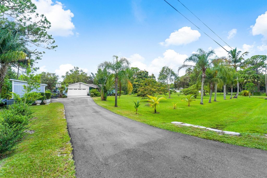 Photo of 13886 158th Street N, Jupiter, FL 33478 (MLS # R10920941)