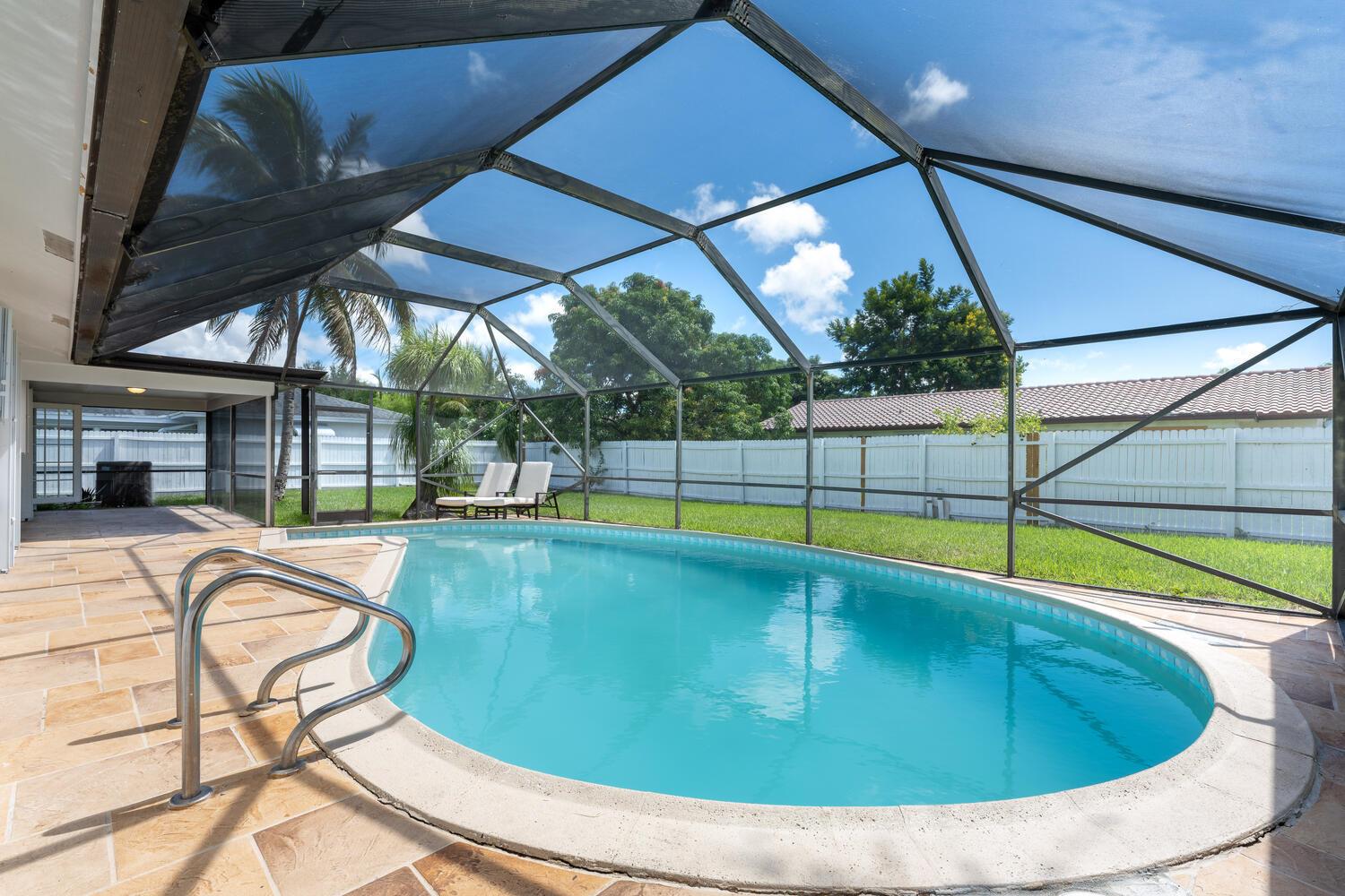 Recently renovated 3 bedroom home located in highly desirable location. Around the corner from Pine Crest , St Andrews, Lynn University and Town Center Mall. Open kitchen, breakfast area and expansive living room with beautiful lush tropical backyard. Screened patio and pool.