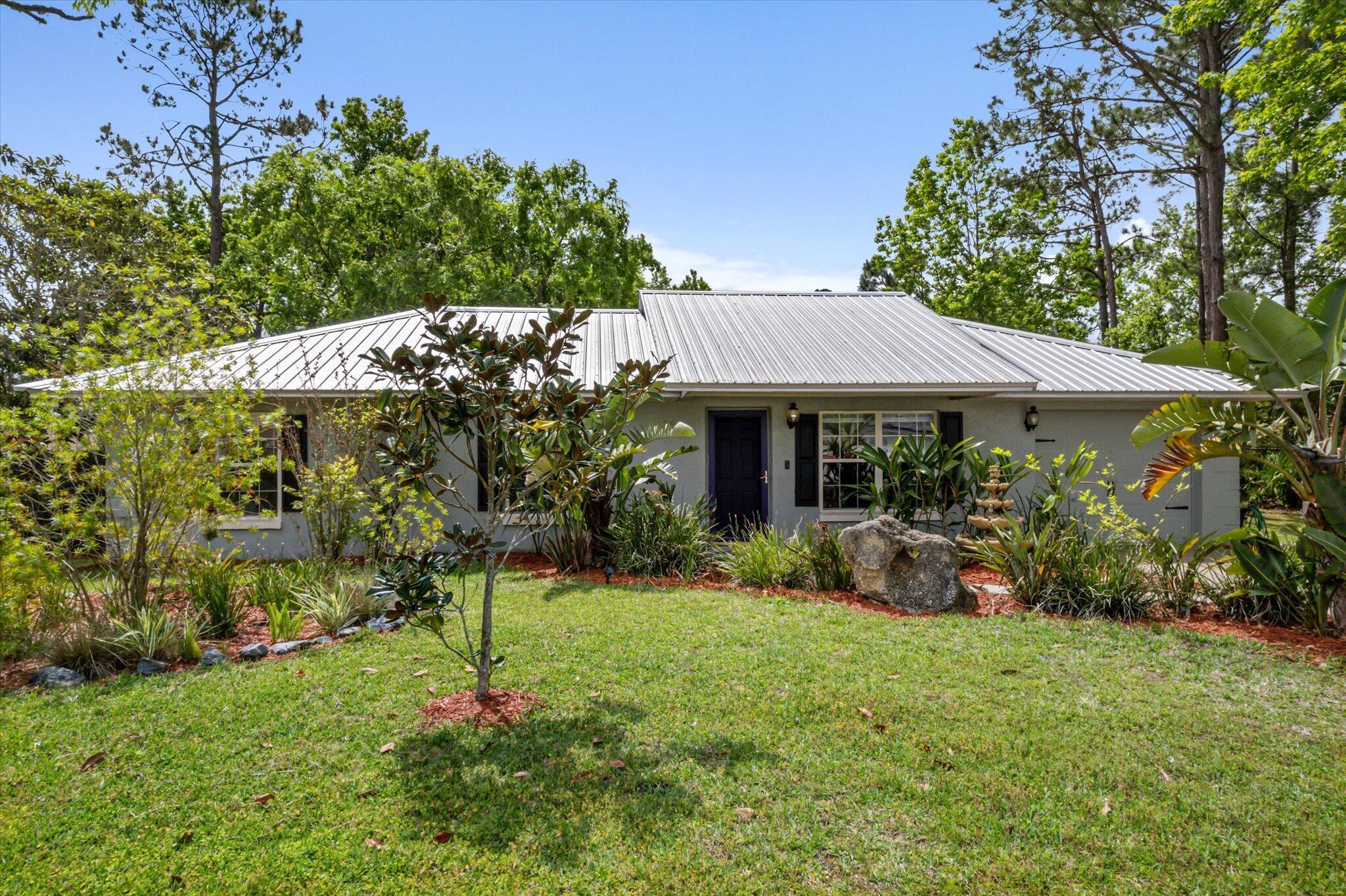 Welcome to this beautifully maintained 3-bed, 2-bath pool home on a rare DOUBLE LOT--over half an acre with endless potential! Expand, build a guest house, or enjoy the extra space and privacy. Features include a custom saltwater pool (2019), metal roof (2019), updated A/C (2021), and storage shed (2018). Inside, enjoy fresh paint, new window coverings, and a bright, open layout perfect for relaxing or entertaining. Lush landscaping and a custom mailbox add charm, but the double lot truly sets this home apart. Just 1 mile from a new $13M dog park, pickleball, and rec center, and near top schools, shopping, parks, and only 15 mins to Flagler Beach.