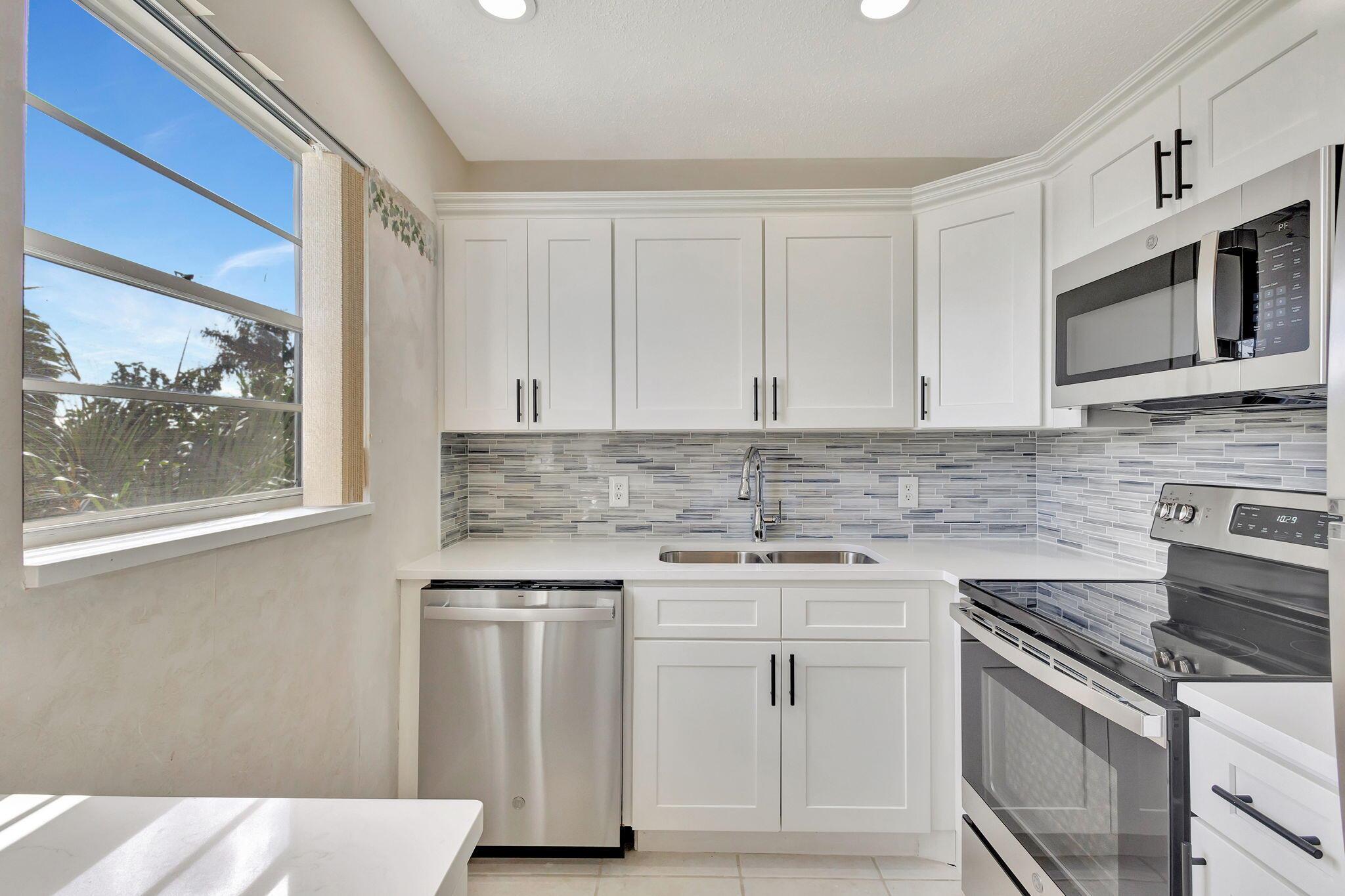 DISCOVER ELEGANT LIVING IN THIS STUNNING FURNISHED 2 BED 1 1/2 BATH CORNER UNIT IN CENTURY VILLAGE,. A GATED COMMUNITY FOR ACTIVE 55+ADULTS. THIS SUN FILLED SECOND FLOOR UPDATED GEM BOASTS A NEW KITCHEN WITH GRANITE COUNTERS, NEW STAINLESS STEEL APPLIANCES AND A DOUBLE SINK UPDATED BATHROOMS & SOPHISTICATED FURNISHINGS.PLUS CENTRAL AIR...Roomy closets (one walk-in), screened-in patio, laundry room, assigned parking spot plus visitor parking available; local bus for errands/shopping both within & outside The Village; ENJOY THE ASSOCIATION'S PATIO AND EMBRACE A RESORT- STYLE LIFESTYLE IN THIS CENTRALLY LOCATED GEM. CLOSE TO THE HASTINGS FITNESS CENTER AND THE CLUBHOUSE.COME AND ENJOY RESORT STYLE LIVING.