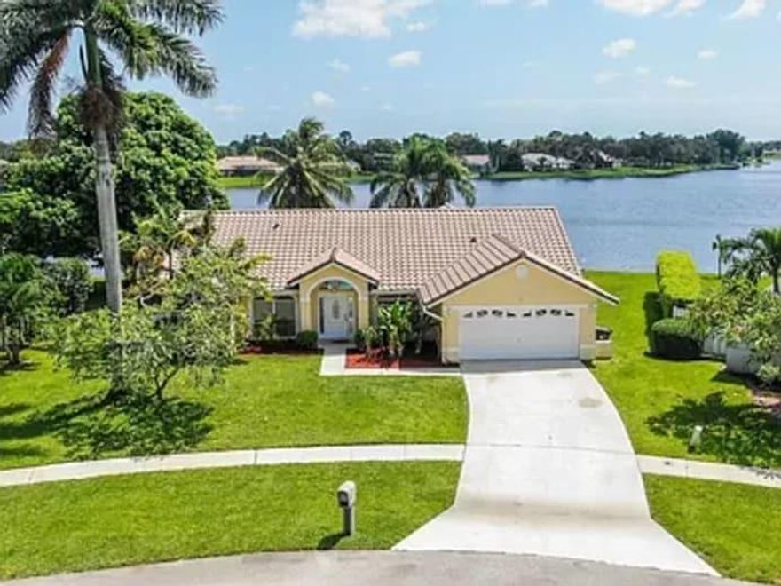 Waterfront with dock, pool, New Tile roof (2/2018), New A/C upgraded 5 ton (3/2015), elevated commodes, granite kitchen top, stainless steel appliances.