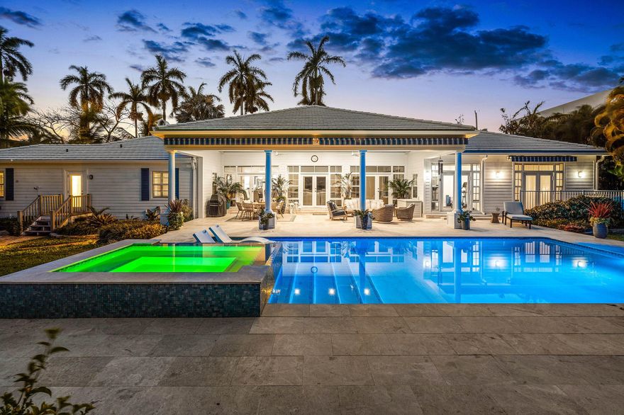 An exceptionally rare offering in the heart of East Delray Beach, just two short blocks from both the beach and the vibrant energy of Atlantic Avenue, this beautifully renovated seaside cottage presents a true coastal sanctuary in one of South Florida's most coveted locations.

Set on an expansive corner estate lot spanning over 20,000 square feet, the residence offers 4 bedrooms, 3.1 bathrooms and over 5,000 total square feet of thoughtfully designed space, a remarkable and increasingly rare find so close to both downtown and the ocean. The sheer scale of the property offers a level of privacy, green space, and enduring significance that is virtually unheard of in this premier beachside location. Exquisitely updated while preserving its timeless charm, the residence blends classic coastal elegance with modern luxury. A decorative Chicago Brick circular driveway welcomes you to a charming front porch and inviting entry, where sunlight pours through impact windows and doors, illuminating vaulted ceilings, rich hardwood floors, and marble accents throughout. Inside, a formal living room with gas fireplace offers warmth and sophistication, while the dining area and family room open through French doors to the lush backyard for seamless indoor-outdoor living. The gourmet kitchen features state-of-the-art appliances, custom cabinetry, a pantry, granite countertops, and an island with snack bar seating--perfect for both entertaining and everyday living.

The private primary wing features its own patio, generous dual walk-in closets with built-ins, and a beautifully appointed bath with dual sinks and soaking tub. A dedicated gym overlooking the pool offers an inspiring setting for wellness and could easily be reimagined as a private office. The upstairs bonus room provides flexibility as a media room, recreation space, office, or den. 

Outdoor living is nothing short of spectacular. A beautifully grand, covered loggia offers an elegant setting for al fresco dining and refined lounging, all overlooking the oversized pool and expansive, lush, manicured grounds - creating a private resort-style retreat just moments from the ocean. The grounds are meticulously manicured with abundant green space, enhanced by full-scale professional landscaping and custom lighting showcasing lush tropical foliage and rare trees.

Recent enhancements further elevate the home's appeal and peace of mind, including a sophisticated wet bar addition, renovated powder room, tankless water heater (2023), new A/C (2025), motorized blackout shades in the living room, gym, and primary suite, and a completely redesigned and resurfaced 20' x 40' heated pool with a sun shelf, integrated spa, and new equipment. Additional improvements include an upgraded crawl space with new dehumidifier, regraded drainage with new sump system, interior paint, recessed lighting, and a full-home water filtration system. 

Additional features include a whole-house generator, fully fenced yard, separate laundry room with ample storage, plantation shutters, dual-zoned A/C, and a two-car garage with a separate drive and private entrance on Seabreeze Avenue.

This meticulously maintained East Delray Beach retreat offers a truly rare opportunity to own a 20,000+ square foot estate property just moments from the sand and the very best of downtown living.