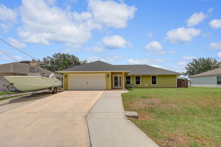 Welcome to this beautifully maintained and upgraded 3 bed, 2 bath home on nearly half an acre. This home features an open floor plan with vaulted ceilings, hardwood floors, upgraded bathrooms, and a spacious kitchen with 1 year old appliances and a large window overlooking a private backyard oasis. All bedrooms have custom-built walk-in closetsStep outside to enjoy the above-ground pool with a brand-new 2025 pump, firepit area, and an oversized, custom-covered paver patio--perfect for entertaining. The garage is finished with an epoxy floor, Swiss-Trax system, and built-in cabinetry.Additional features include a new 2024 roof, clear panel hurricane shutters, and an extra-wide driveway ideal for boats or RVs. ASSUMABLE VA LOAN. CALL FOR MORE INFO.