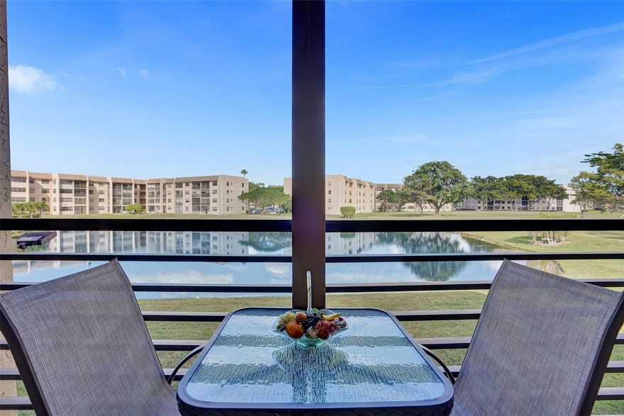Discover your dream home in Sunrise Lakes a 55+ community with this beautiful 2 bedroom, 1.5 bathroom condo with lake front and golf course view. Enjoy your white kitchen with newer appliances, newer flooring, updated bathrooms, and screened in balcony with a breathtaking view. AC and WH 7 years old, impact windows, roll down shutters, elevator 2024, and golf course free to residents.