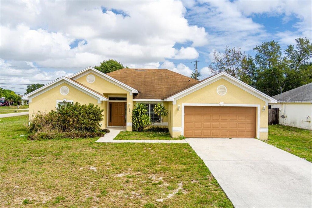 Photo of 291 SW Covington Road, Port Saint Lucie, FL 34953 (MLS # R11081028)