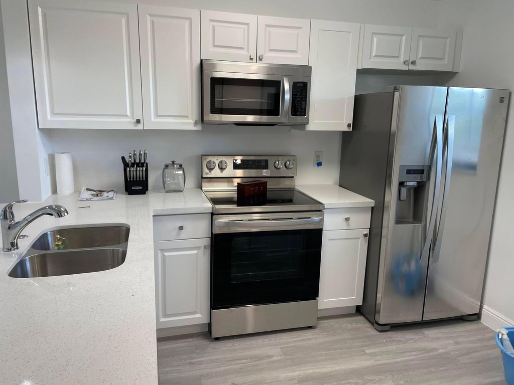 Photo of 7101 Golf Colony Court #203, Lake Worth, FL 33467 (MLS # B26008444)