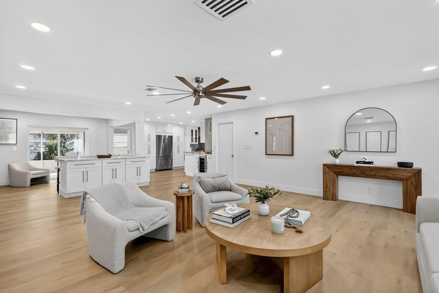 **Seller offering 1 Year of HOA payments credited to buyer at closing* Must see this impeccably updated one of a kind designer home.You are met with a wonderful blend of charm, detail and quality which is evident everywhere you look. Split floor plan with an open concept design.This sprawling 1700sf home includes two spacious ensuite bedrooms. Gorgeous french doors lead you through primary and into the office/den which you can also access through the secret door on the wood paneled wall in the main living space.This expansive home features a dream custom kitchen with Brand new KitchenAid and FORNO appliances, Large Quartz Island and countertops, substantial counter space and storage, real wood soft close cabinetry, double pantries with pull outs,Fireclay Workstation/Apron Sink Kraus Faucet w/Reverse Osmosis Water Filtration System,
Custom made Hood with Pot Filler, Pottery Barn Floating Shelving , Built in 28 Bottle Dual ZoneWine Fridge. Spa like bathrooms feature floor to ceiling tile and curb less showers. New Floors/baseboards 5+inch throughout. Brand New Samsung front load washer/dryer w storage drawers & Premium Bamboo Laundry Countertop.Oversized screen enclosed patio has been newly tiled and painted.
Entire interior freshly painted-no popcorn ceilings and smooth walls. All doors, handles, locks, recessed lighting, ceiling fans switches and outlets are new.
Entire exterior has been stucco'd and painted
New Fascia & New soffits
Roof and exterior pressure cleaned 11/2025
AC and WH 
Garage, driveway and porch repainted and sealed
New hedges and rubber mulch added to front of home
All new exterior lighting.