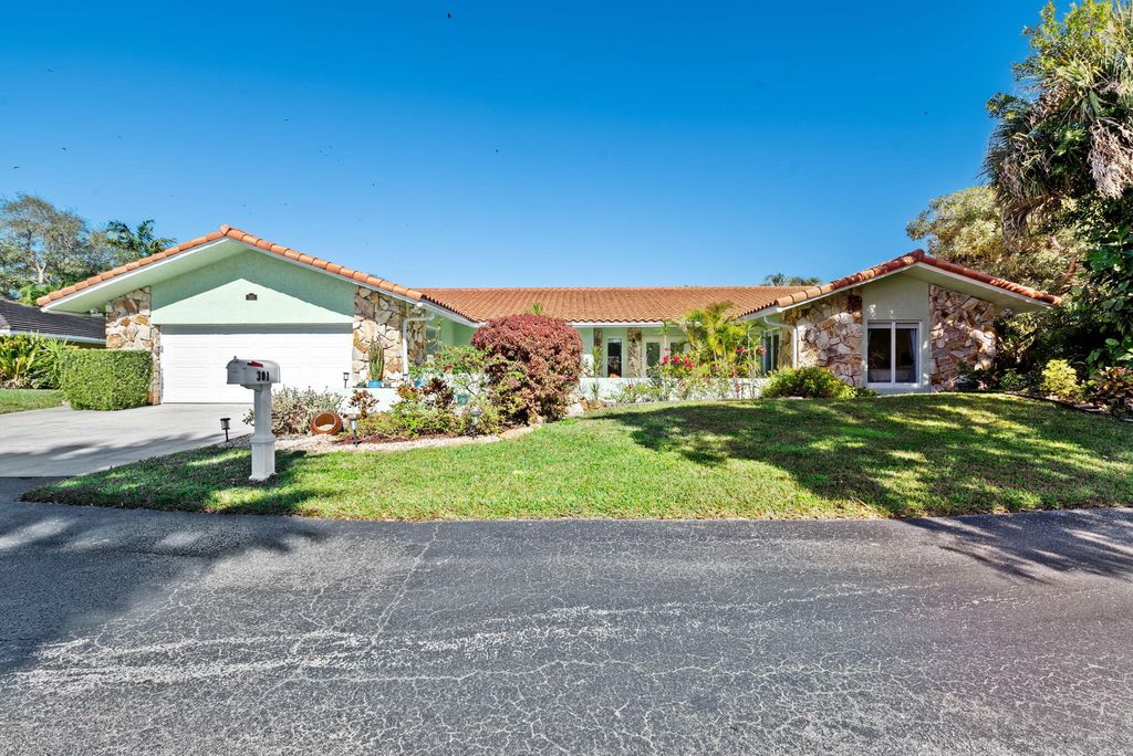 Photo of 301 Jacaranda Drive, Plantation, FL 33324 (MLS # B26016833)