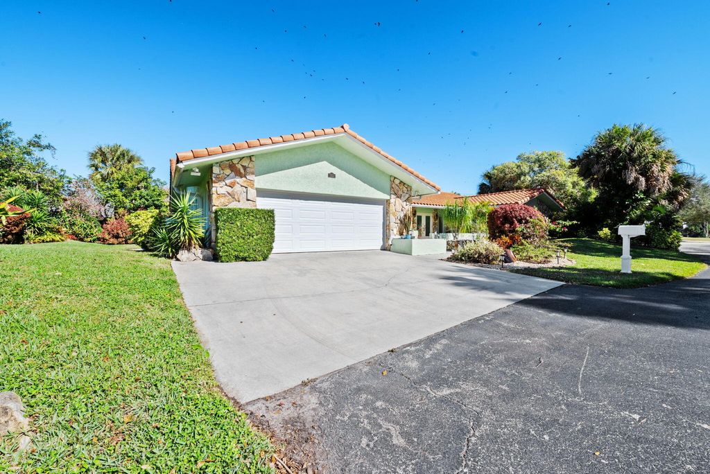 Photo of 301 Jacaranda Drive, Plantation, FL 33324 (MLS # B26016833)