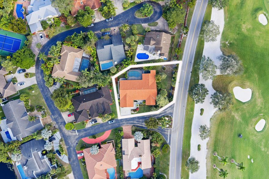 Located in the exclusive community of Jacaranda Royale, this beautifully updated corner-lot home offers stunning golf course views and upgrades throughout.  4 Beds | 3.5 Baths | 3,430 SF under AC | 2-Car Garage  Features include a custom kitchen with solid wood cabinetry, quartzite countertops, and marble backsplash, porcelain flooring throughout, and a spacious primary suite with oversized bath and multiple walk-in closets. Oversized laundry room and plenty storage throughout. Enjoy a screened saltwater pool, large patio with TV hookup and built-in speakers perfect for entertaining.  Major upgrades: Roof (2021), Impact windows/doors & garage door, Dual AC (2021 & 2024), Insulation (2023), Pool system (2025). Fully prewired for high-speed internet and cable in every room.  Prime location close to main roads shopping centers and places of worship