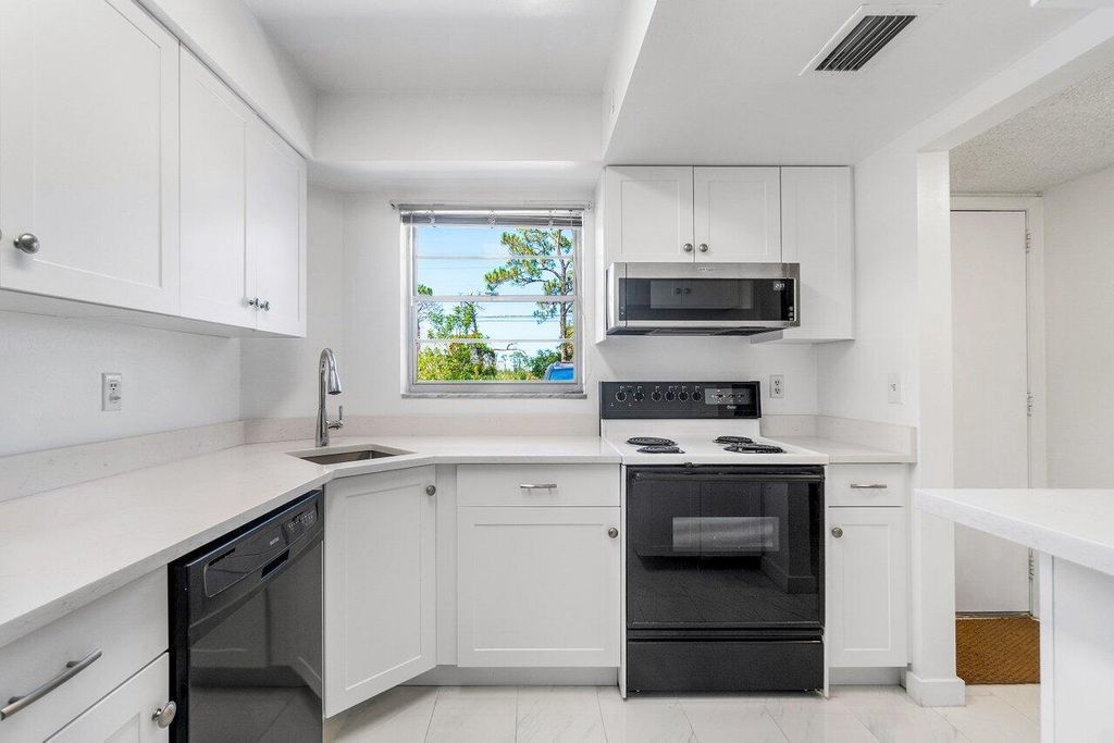Photo of 18081 SE Country Club Drive #32-311, Jupiter, FL 33469 (MLS # R11091314)