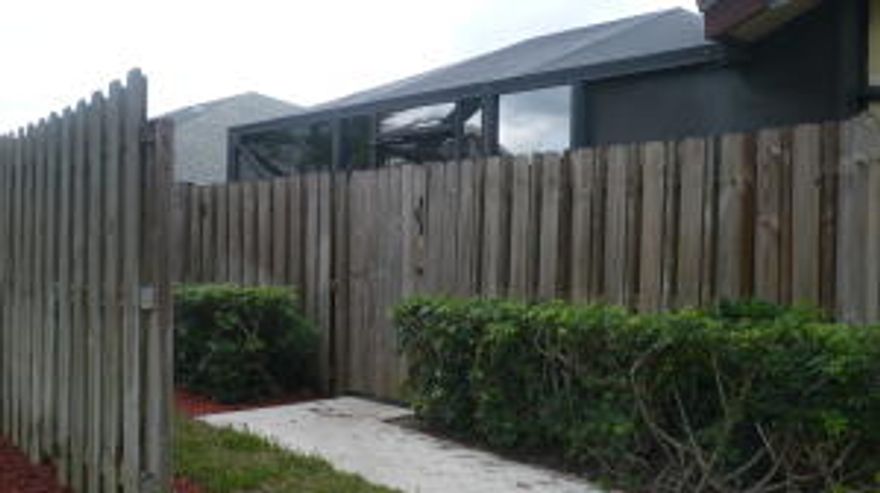 Spacious villa with vaulted ceilings and large exterior fenced patio within walking distance to highly rated New Horizons Elementary School and Tiger Shark Cove park! There is newer carpeting throughout, kitchen with breakfast bar that overlooks a large great room and 2 master bedrooms with private baths. Exterior patio is fenced/screened and all windows have accordian hurricane shutters. Small dog or cat allowed with $150 non-refundable pet fee. No lengthy or expensive HOA app. process here, just background check with Coldwell Banker for $85 first person and $40 additional adult with results in 2 days (excluding weekends).